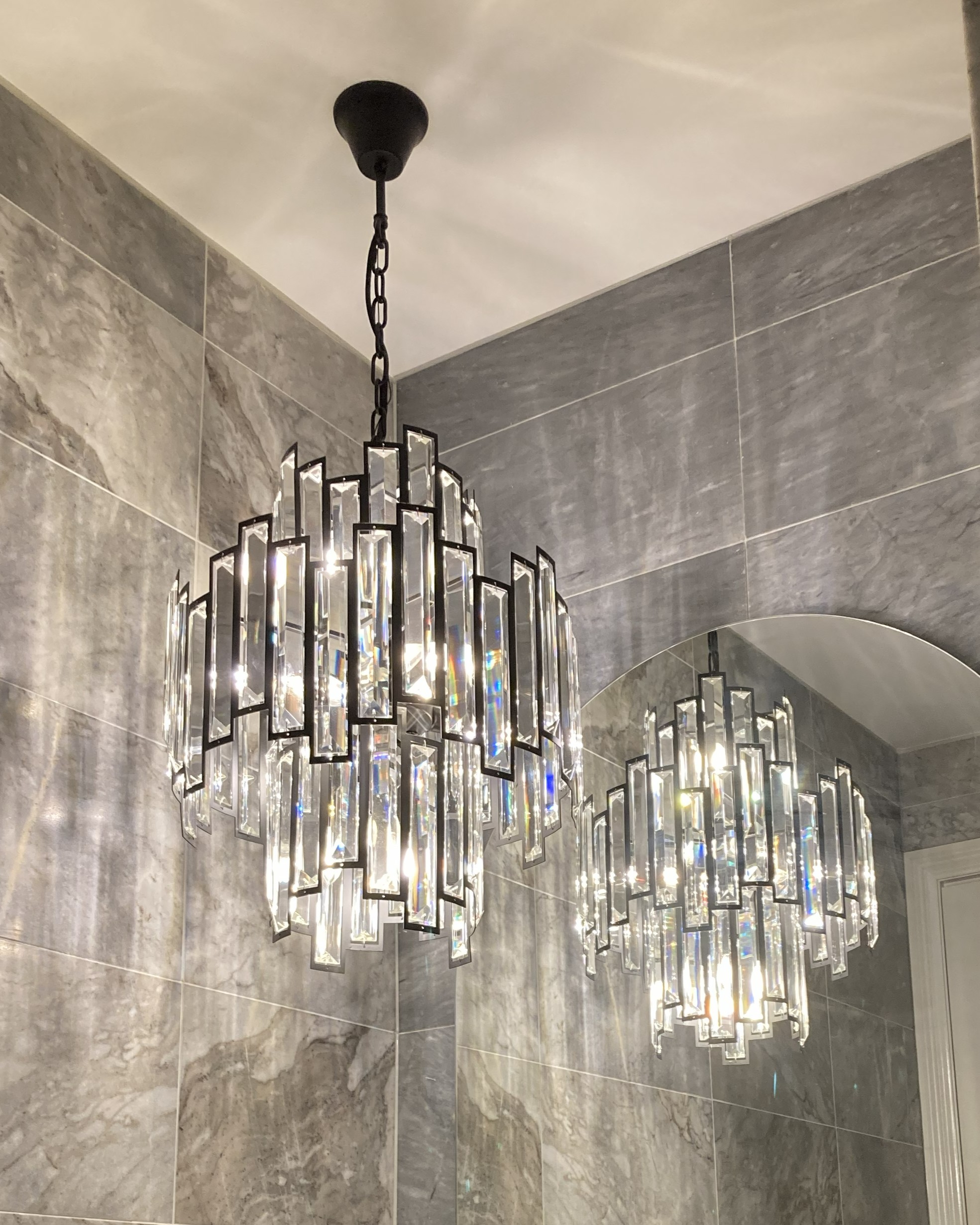 Electrician Installing Chandelier