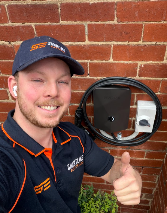 Electrician Installing Chandelier