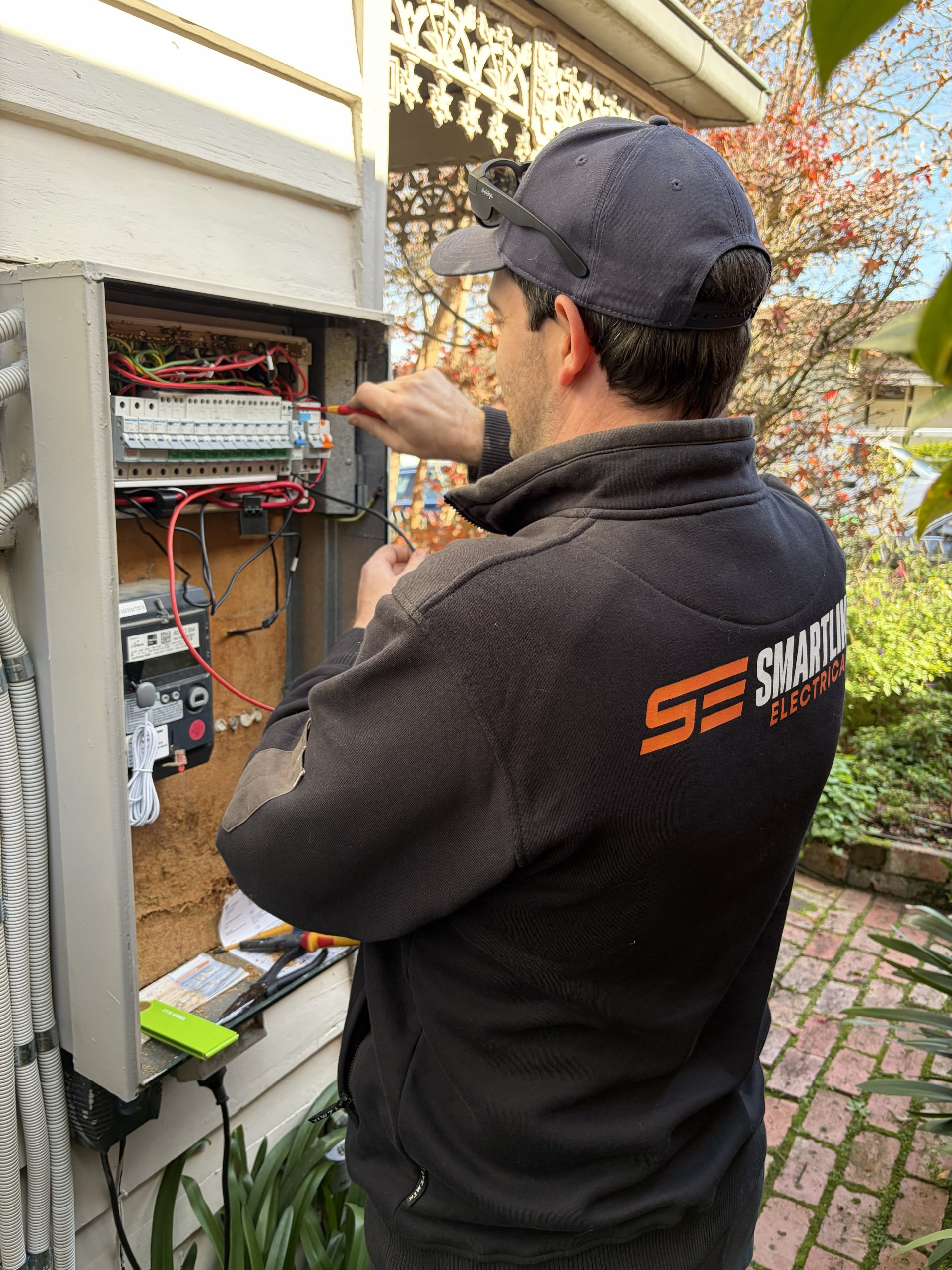 Electrician Installing Chandelier